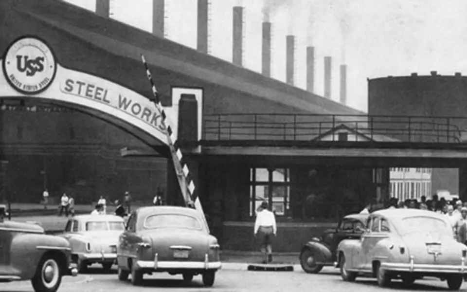 Entrance to US Steel plant and vintage cars
